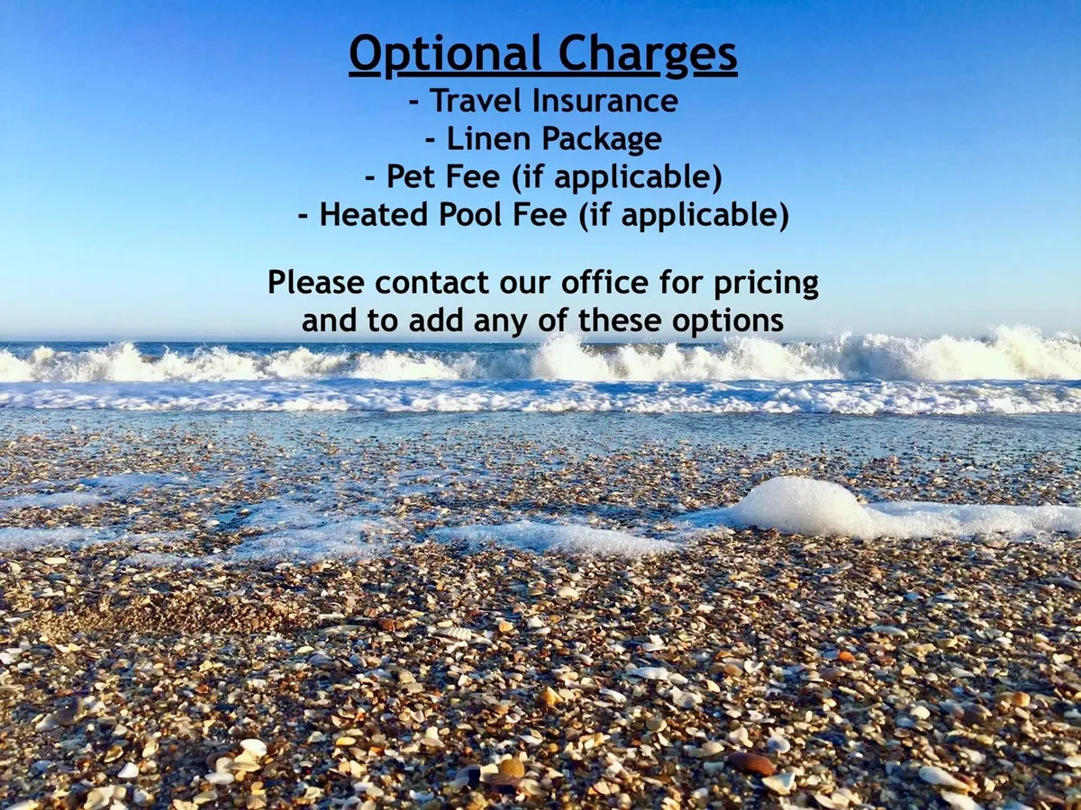 A wide stretch of sandy beach with gentle waves rolling ashore, scattered seashells, and a relaxed ambiance. The lighting suggests either early morning or late afternoon, ideal for beach walks or enjoying sunset views.